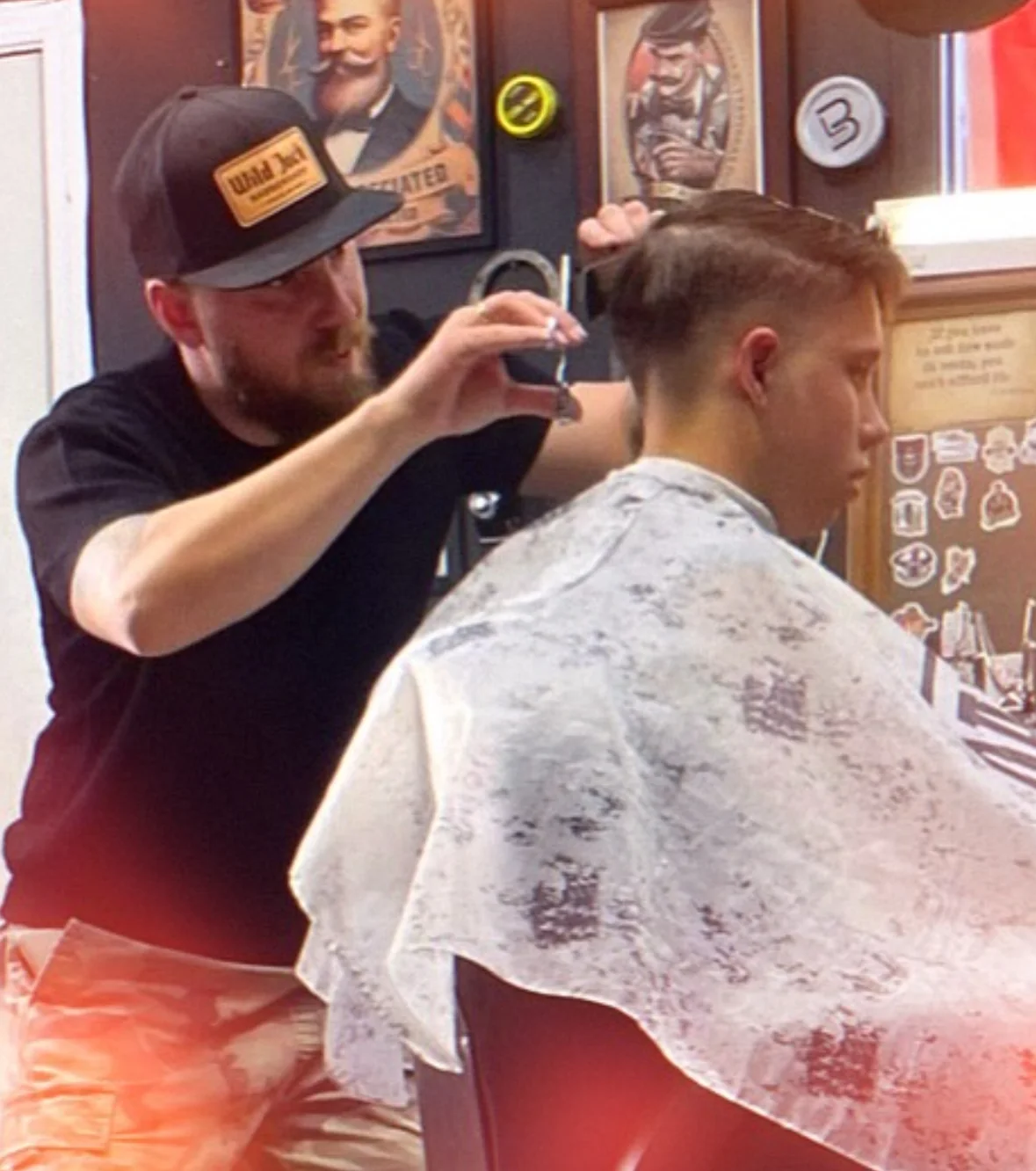 Wild Jack barber giving a haircut